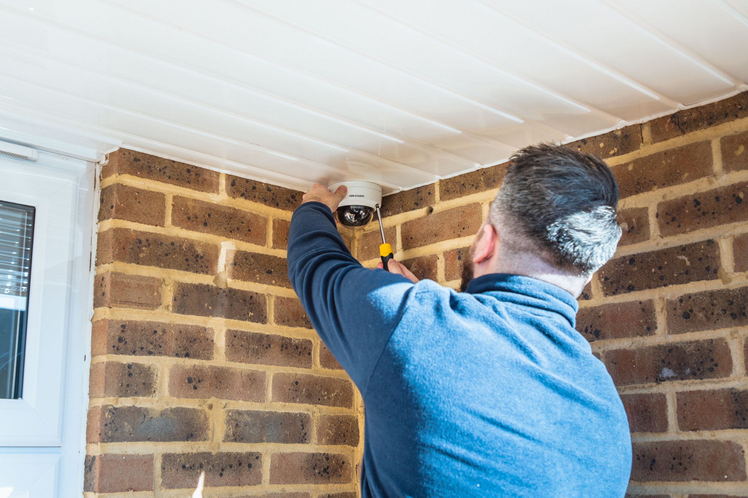 engineer installing cctv camera